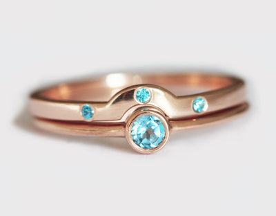 Layered round blue topaz solitaire ring set