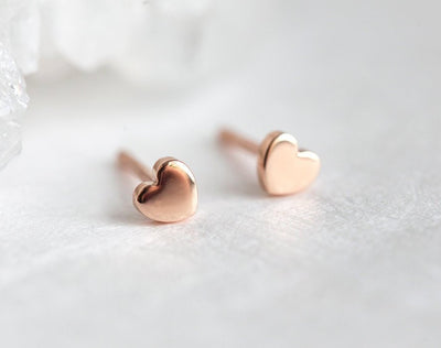 Heart shaped gold stud earrings