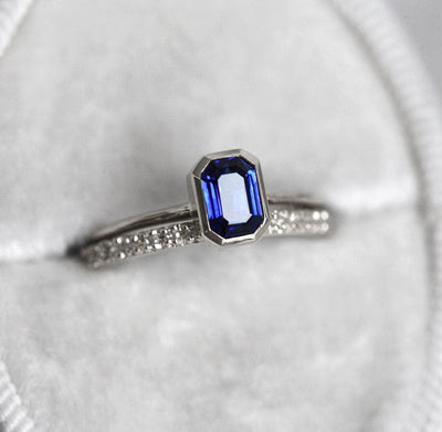 Blue emerald-shaped sapphire ring