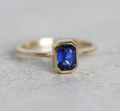 Blue emerald-shaped sapphire ring