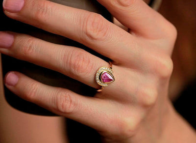 Pear Ruby Halo Ring with Round White Diamonds