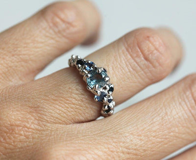 Round blue sapphire cluster engagement ring