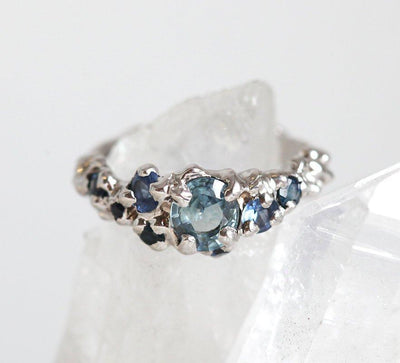 Round blue sapphire cluster engagement ring