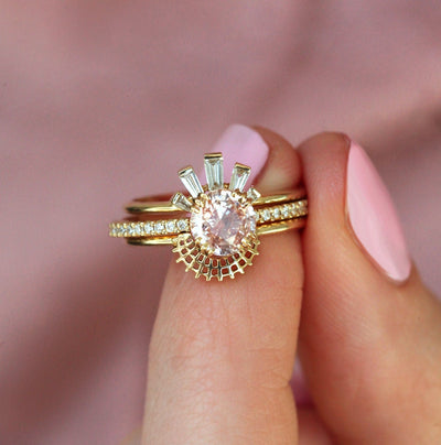 Round peach sapphire eternity ring with diamonds