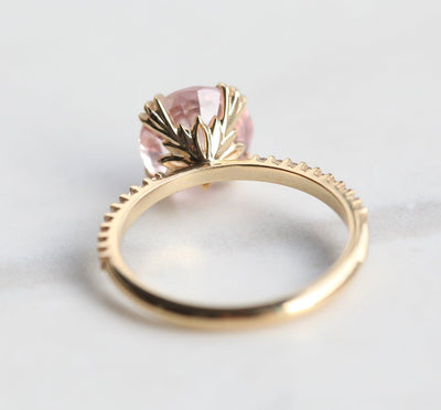 Round peach sapphire eternity ring with diamonds