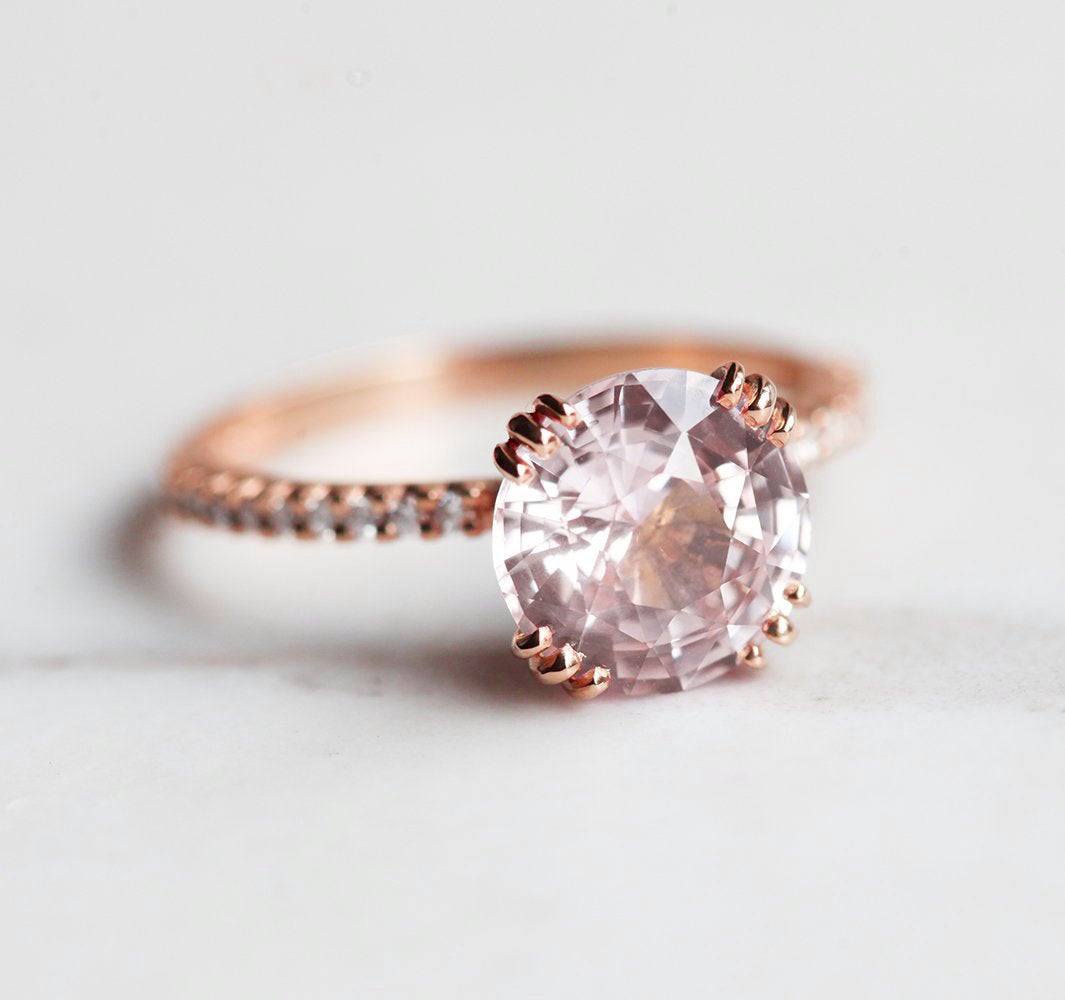 Round pink sapphire eternity ring with diamonds