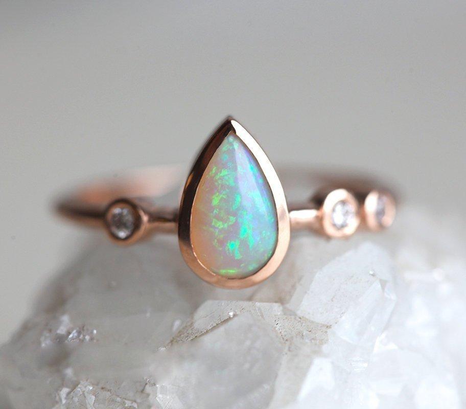 Pear White Opal Ring with 3 Side Round White Diamonds