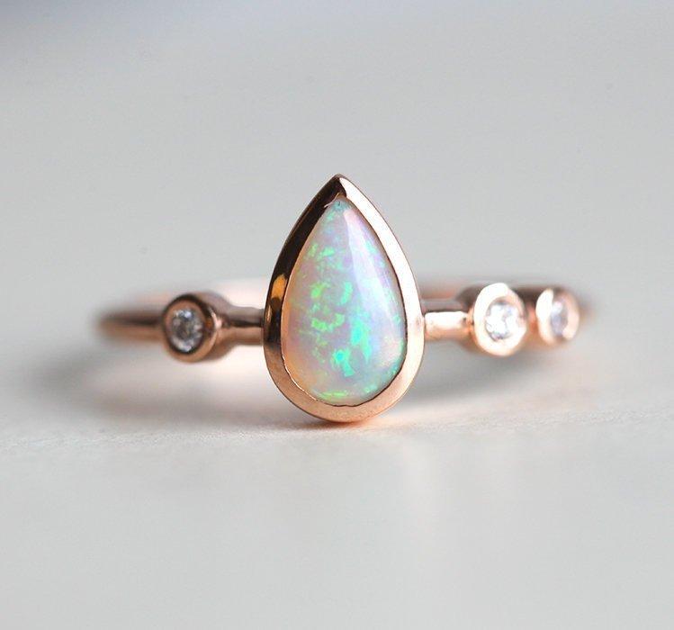 Pear White Opal Ring with 3 Side Round White Diamonds