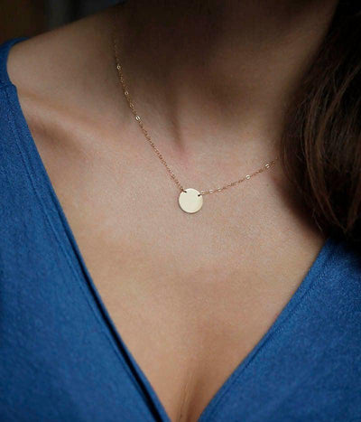 Gold necklace with initial disc