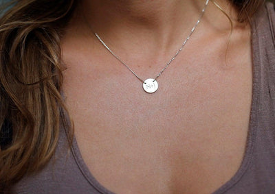 Gold necklace with initial disc