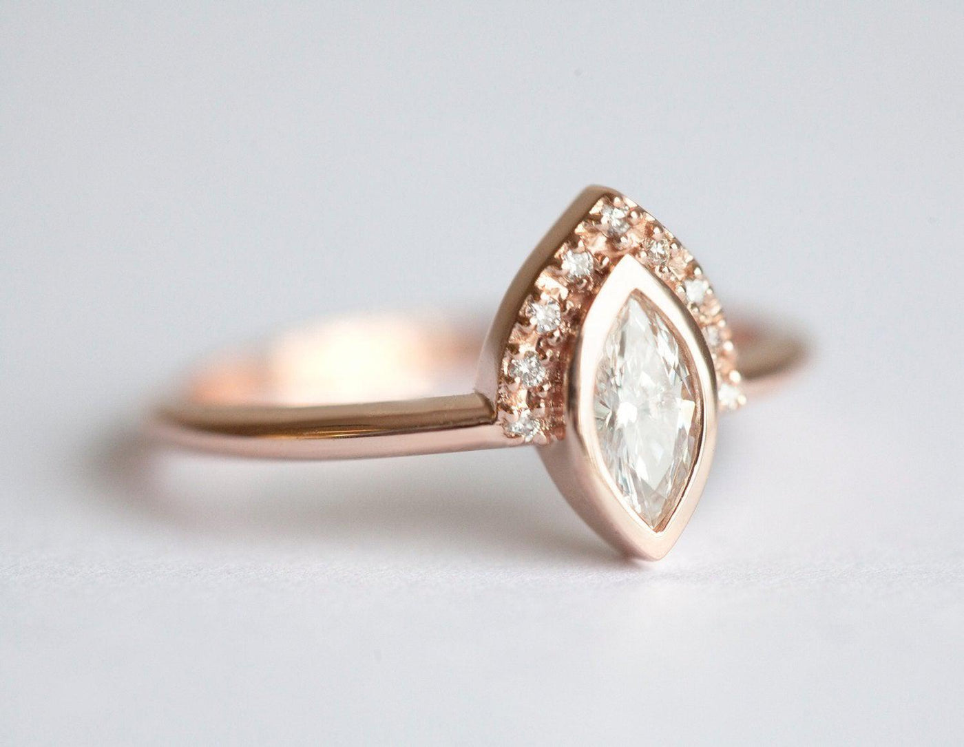 Elegant Marquise-Cut White Diamond Halo Ring with Side White Diamonds