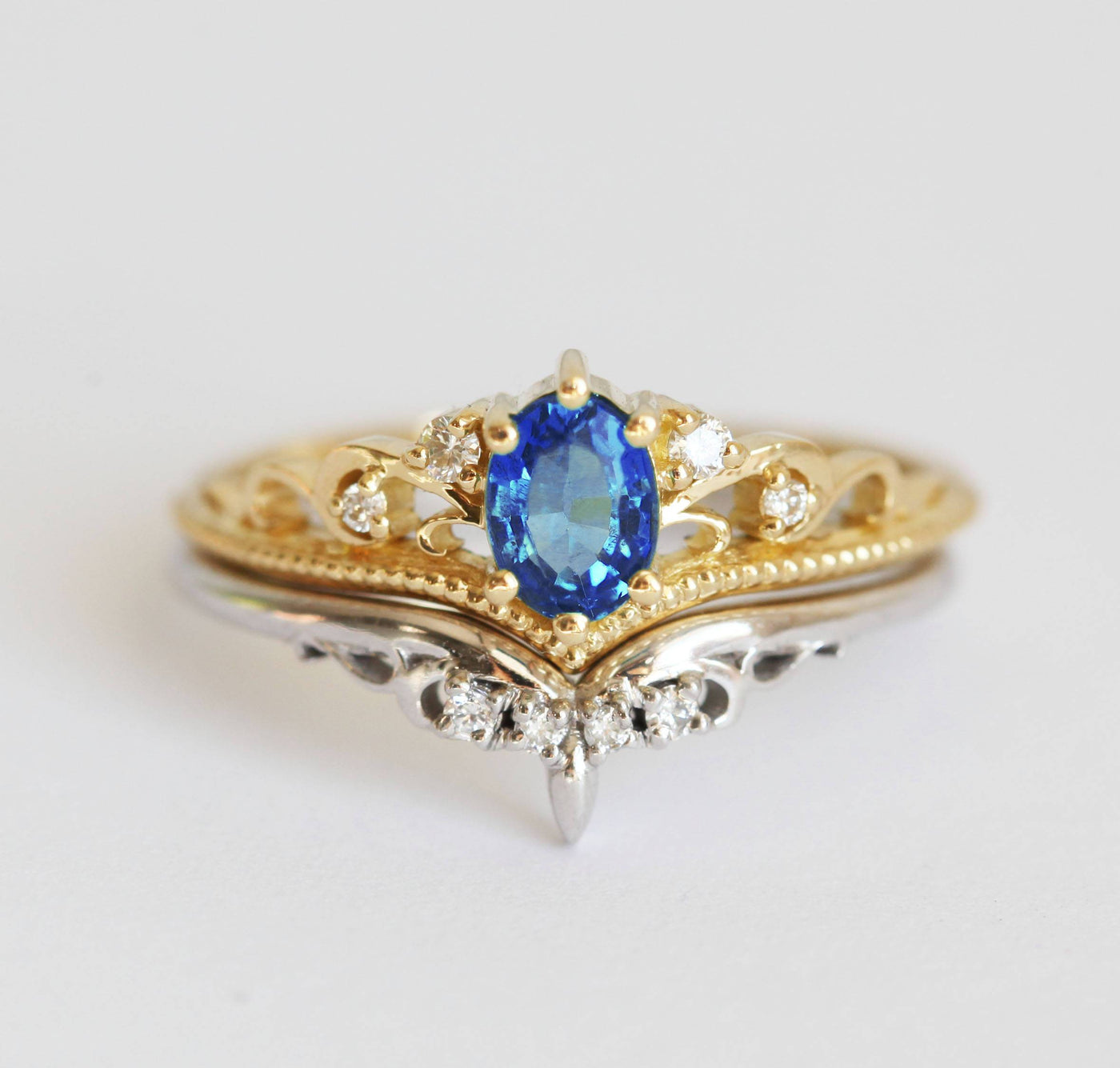 Vintage oval-shaped emerald and sapphire engagement ring