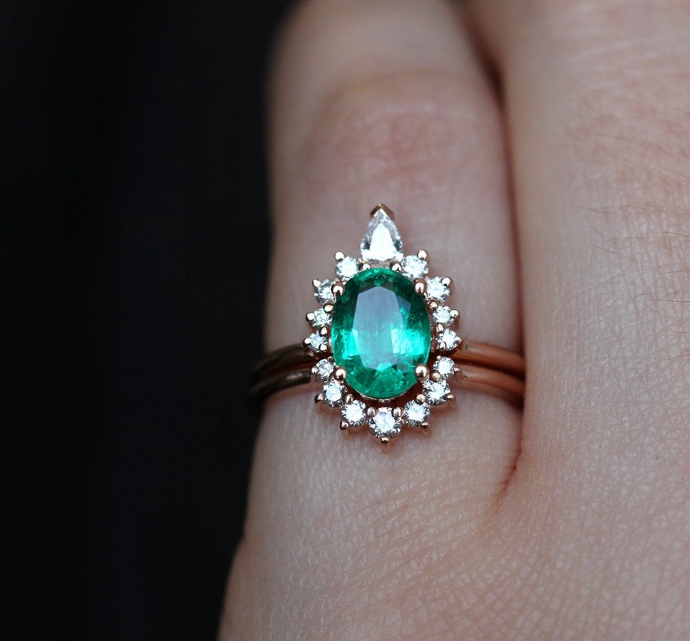 Close-up of Oval Emerald Ring Set with 1.2ct oval-cut natural Emerald and Diamonds.