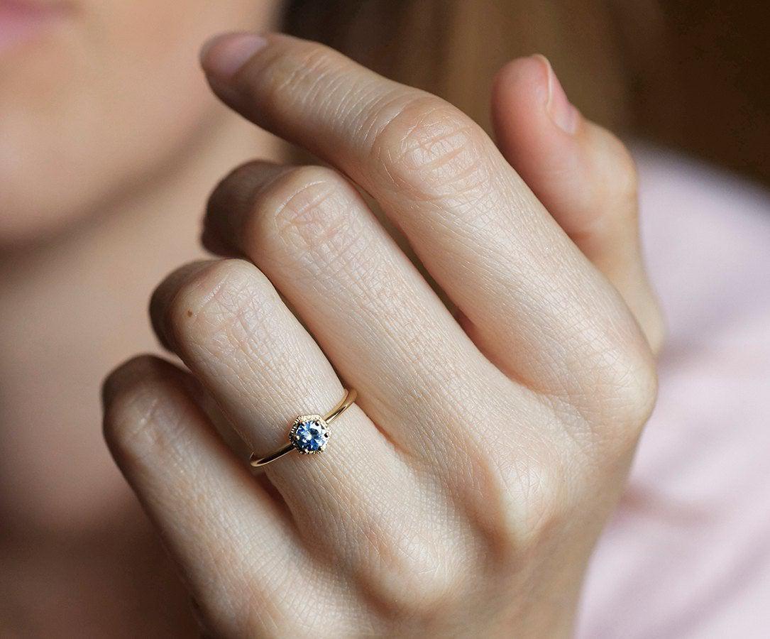 Round light blue solitaire sapphire ring