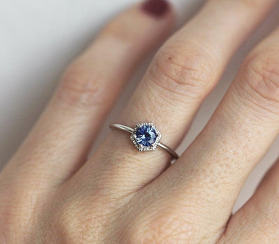 Round light blue solitaire sapphire ring