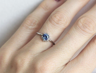 Round light blue solitaire sapphire ring