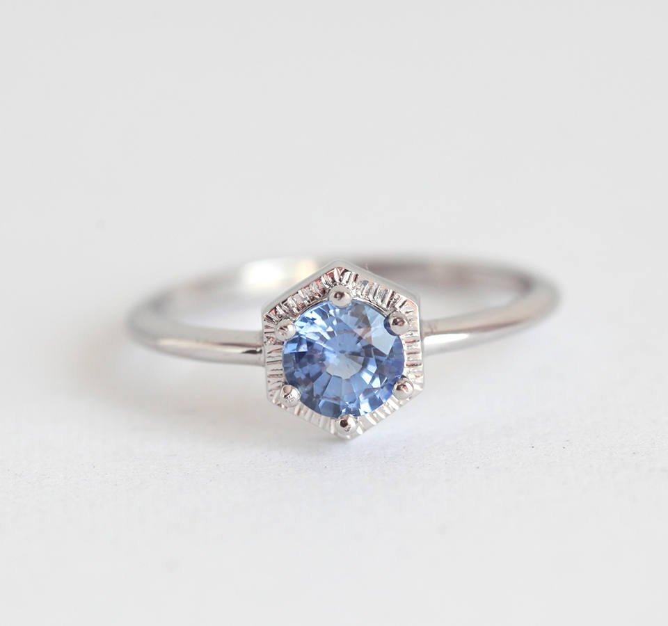 Round light blue solitaire sapphire ring