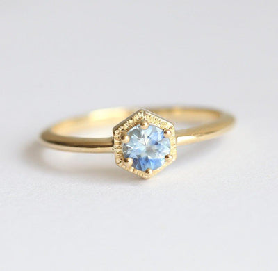 Round light blue solitaire sapphire ring