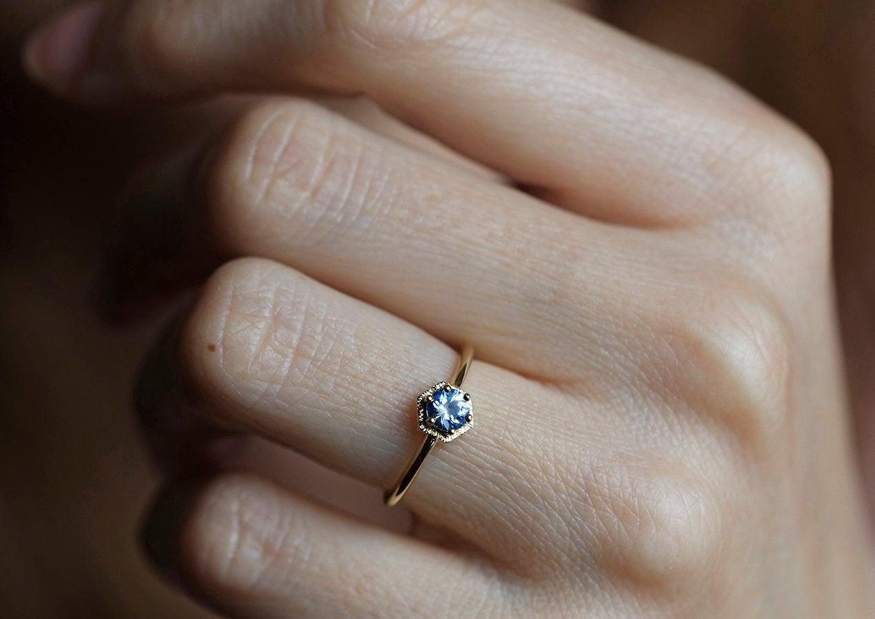 Round light blue solitaire sapphire ring