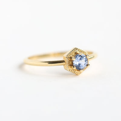 Round light blue solitaire sapphire ring