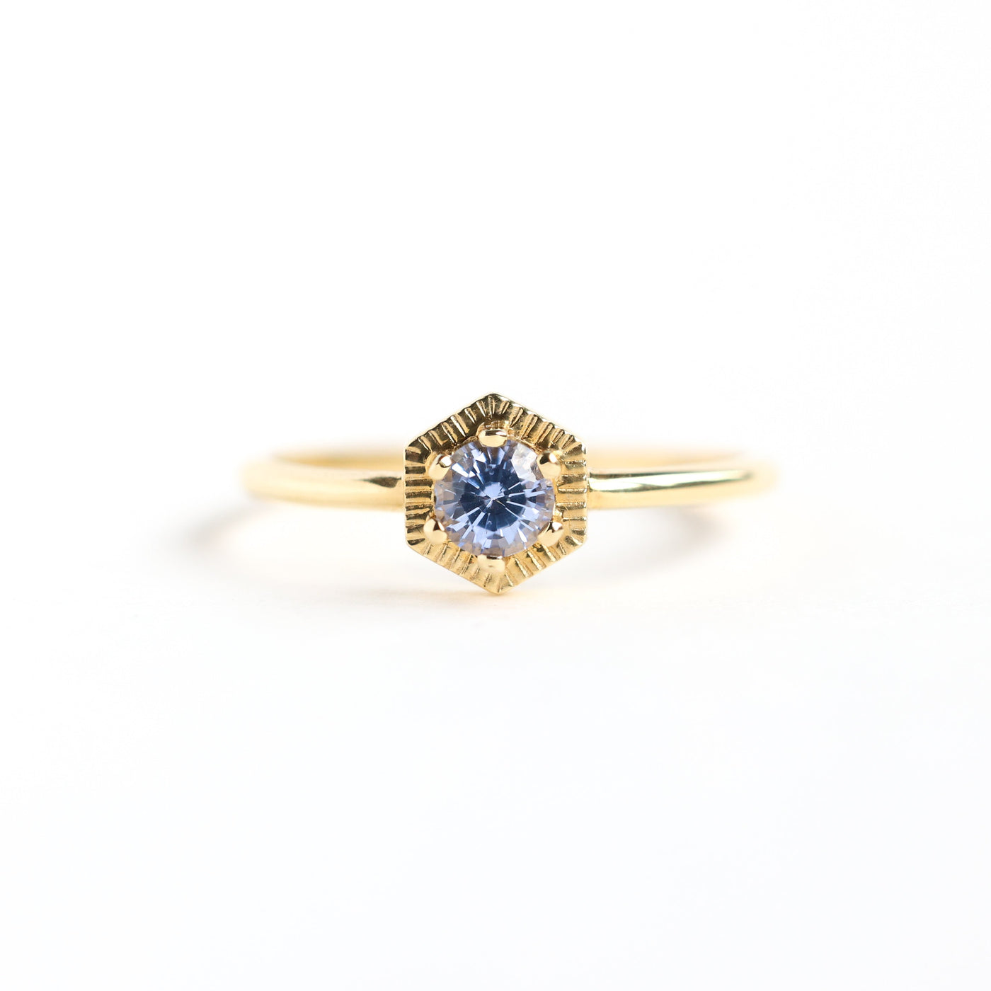 Round light blue solitaire sapphire ring