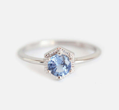 Round light blue solitaire sapphire ring