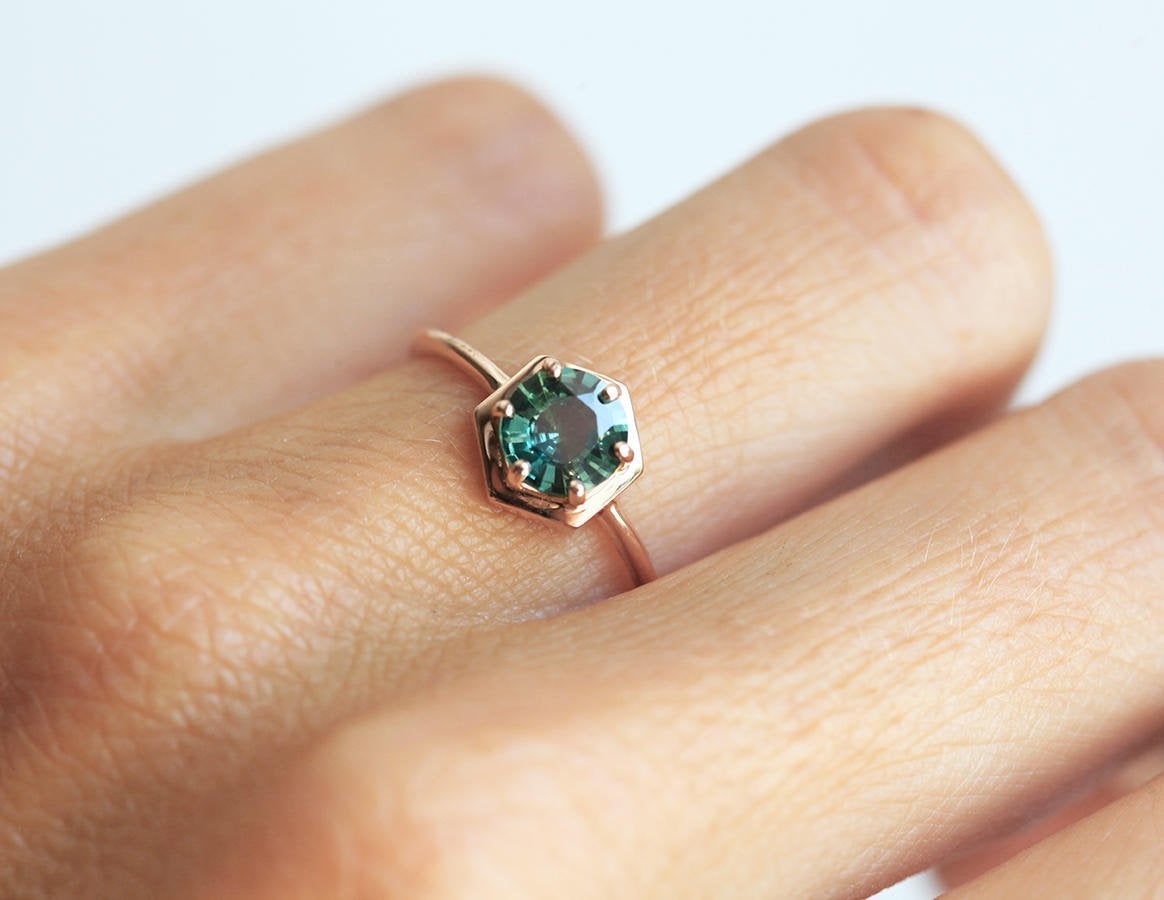 Round teal blue solitaire sapphire ring