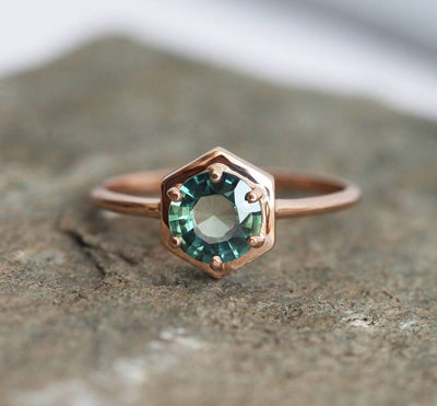 Round teal blue solitaire sapphire ring