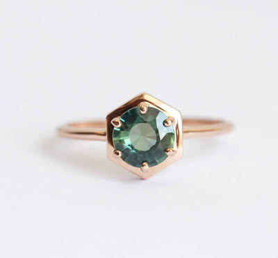 Round teal blue solitaire sapphire ring