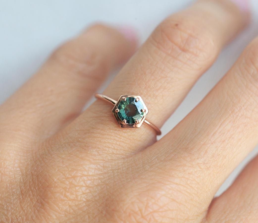 Round teal blue solitaire sapphire ring