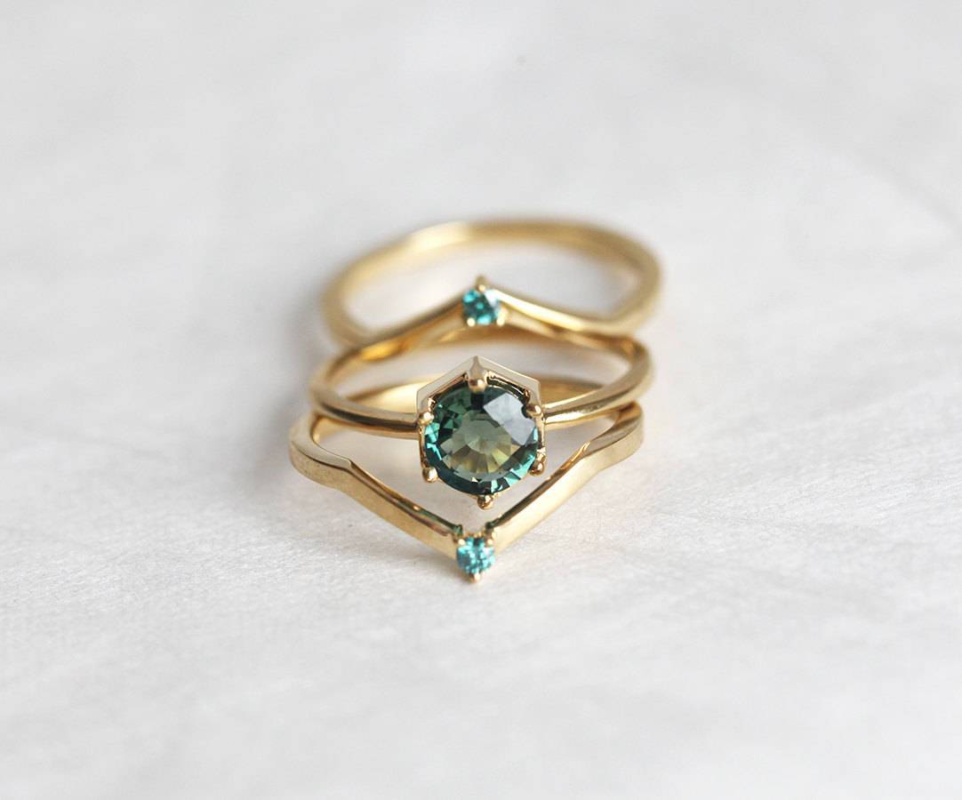 Round teal blue solitaire sapphire ring