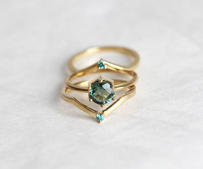 Round teal blue solitaire sapphire ring