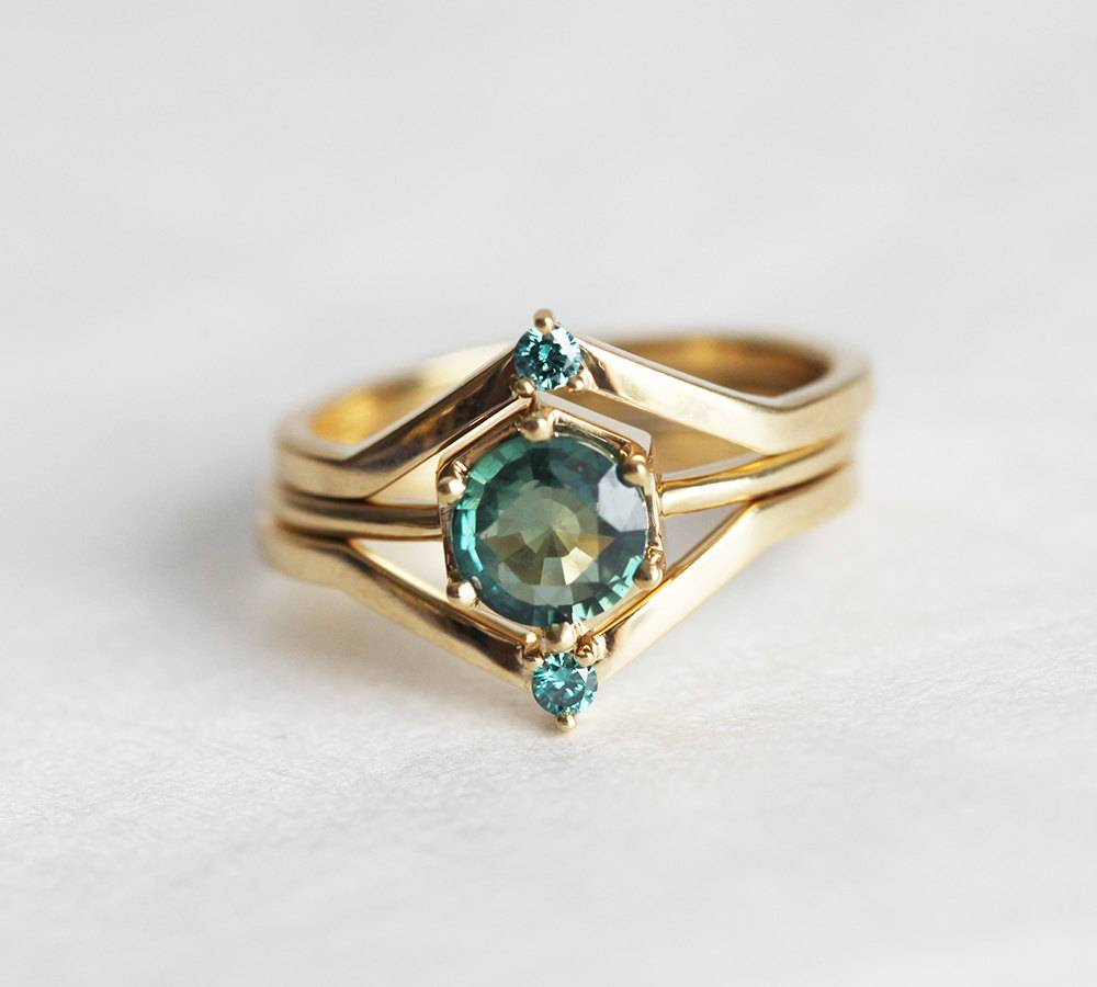 Round teal blue solitaire sapphire ring