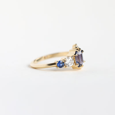 Violet blue radiant sapphire cluster ring with diamonds