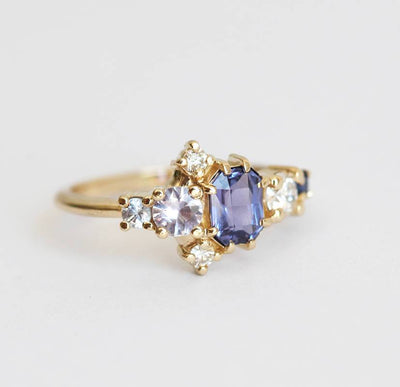 Violet blue radiant sapphire cluster ring with diamonds