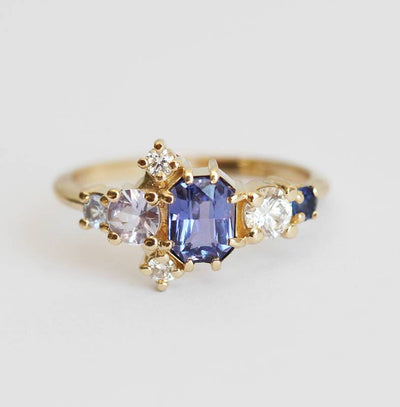 Violet blue radiant sapphire cluster ring with diamonds