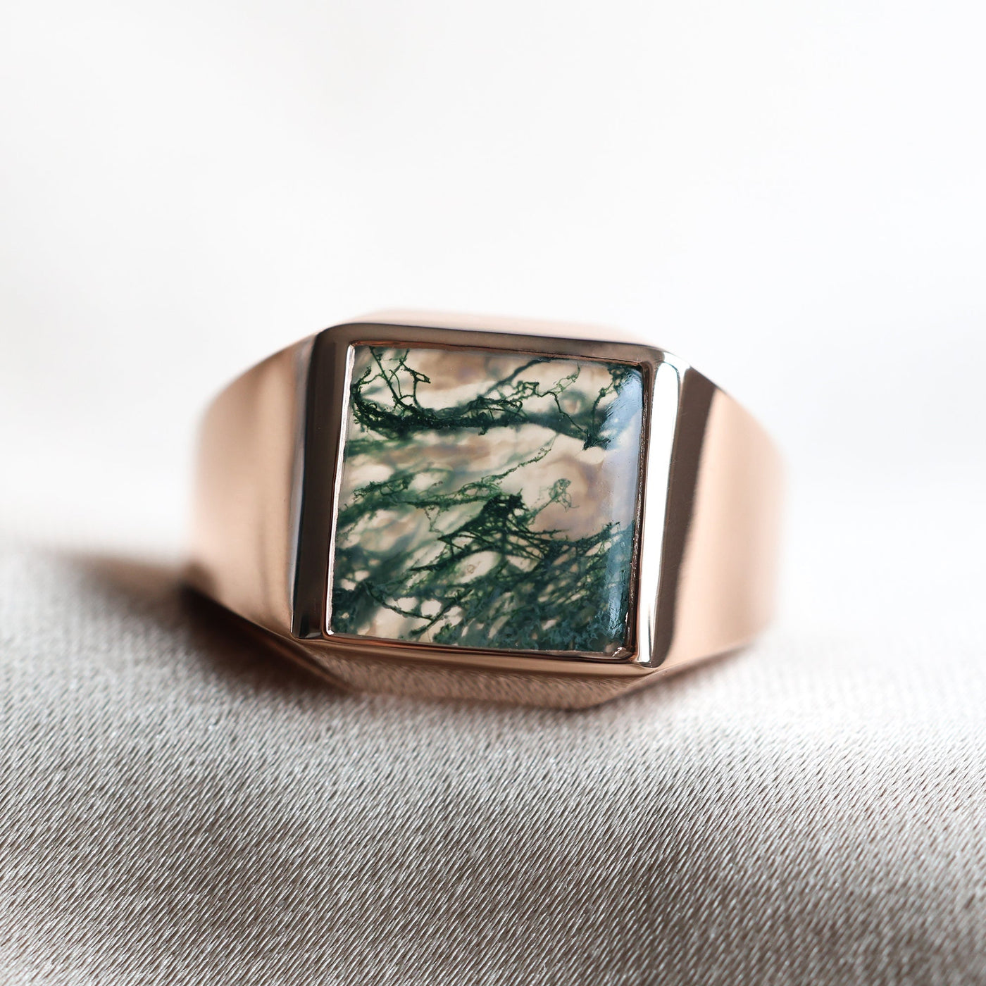 Men's Moss Agate Signet Ring in gold and platinum, showcasing a green stone.