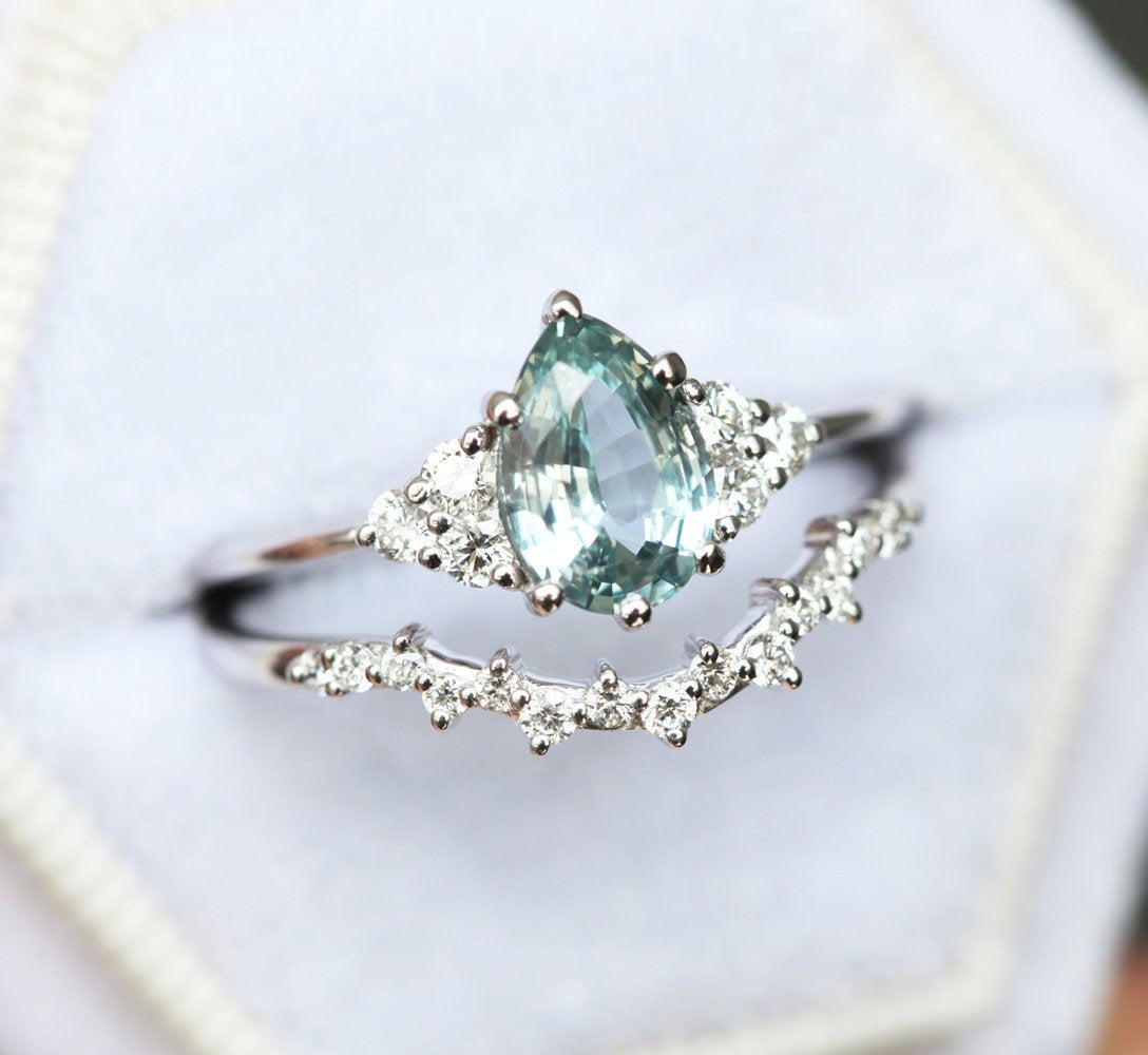 Pear-shaped mint sapphire with side diamonds