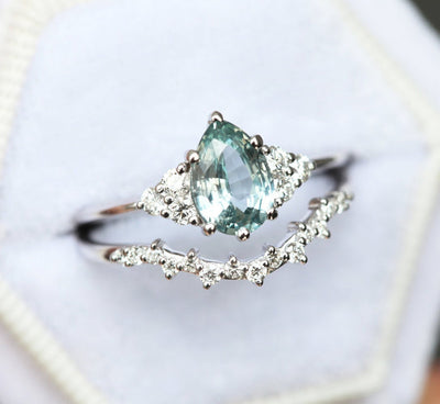 Pear-shaped mint sapphire with side diamonds