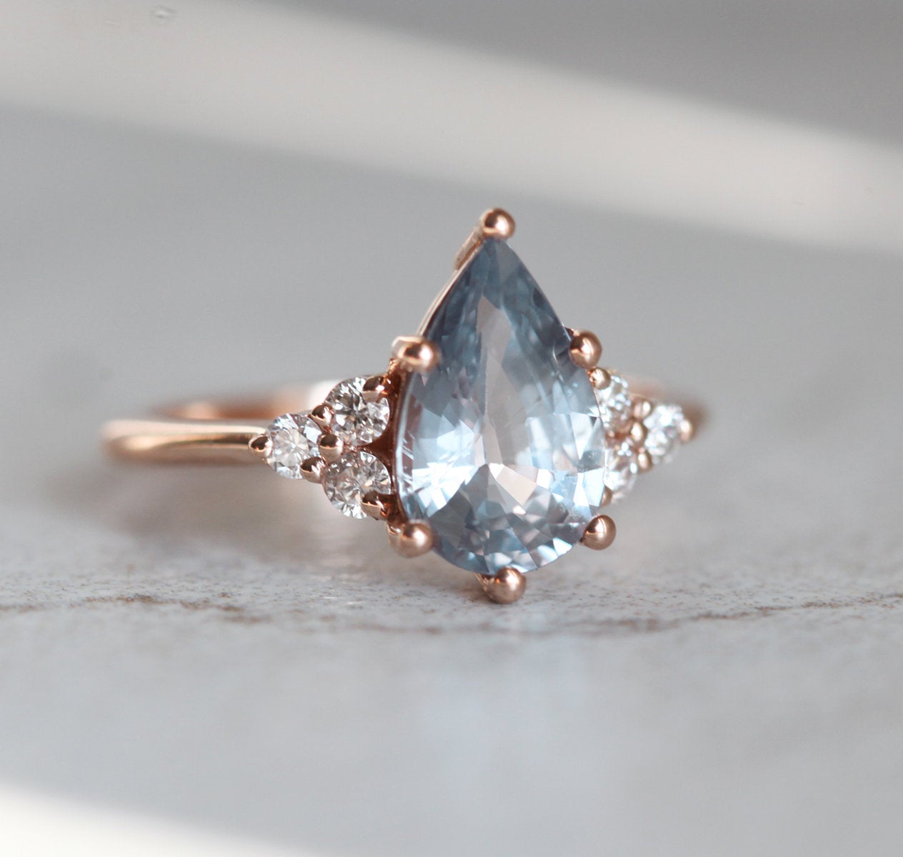 Pear-shaped blue sapphire ring with side diamonds