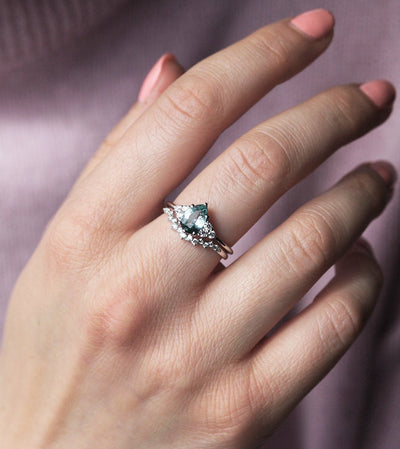 Pear-shaped mint sapphire with side diamonds