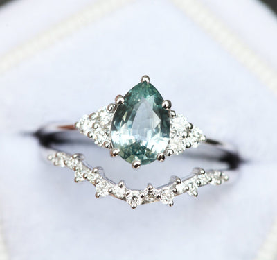 Pear-shaped mint sapphire with side diamonds