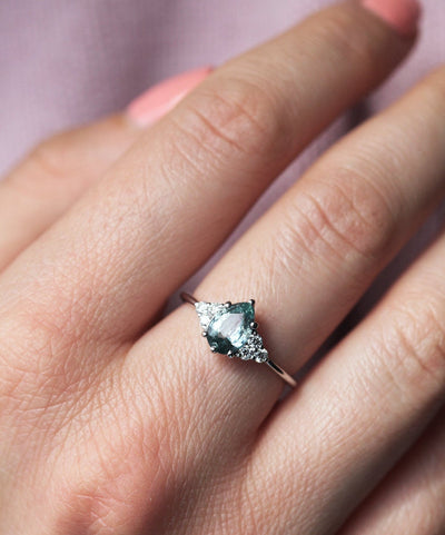 Pear-shaped mint sapphire with side diamonds