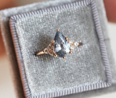 Pear-shaped blue sapphire ring with side diamonds