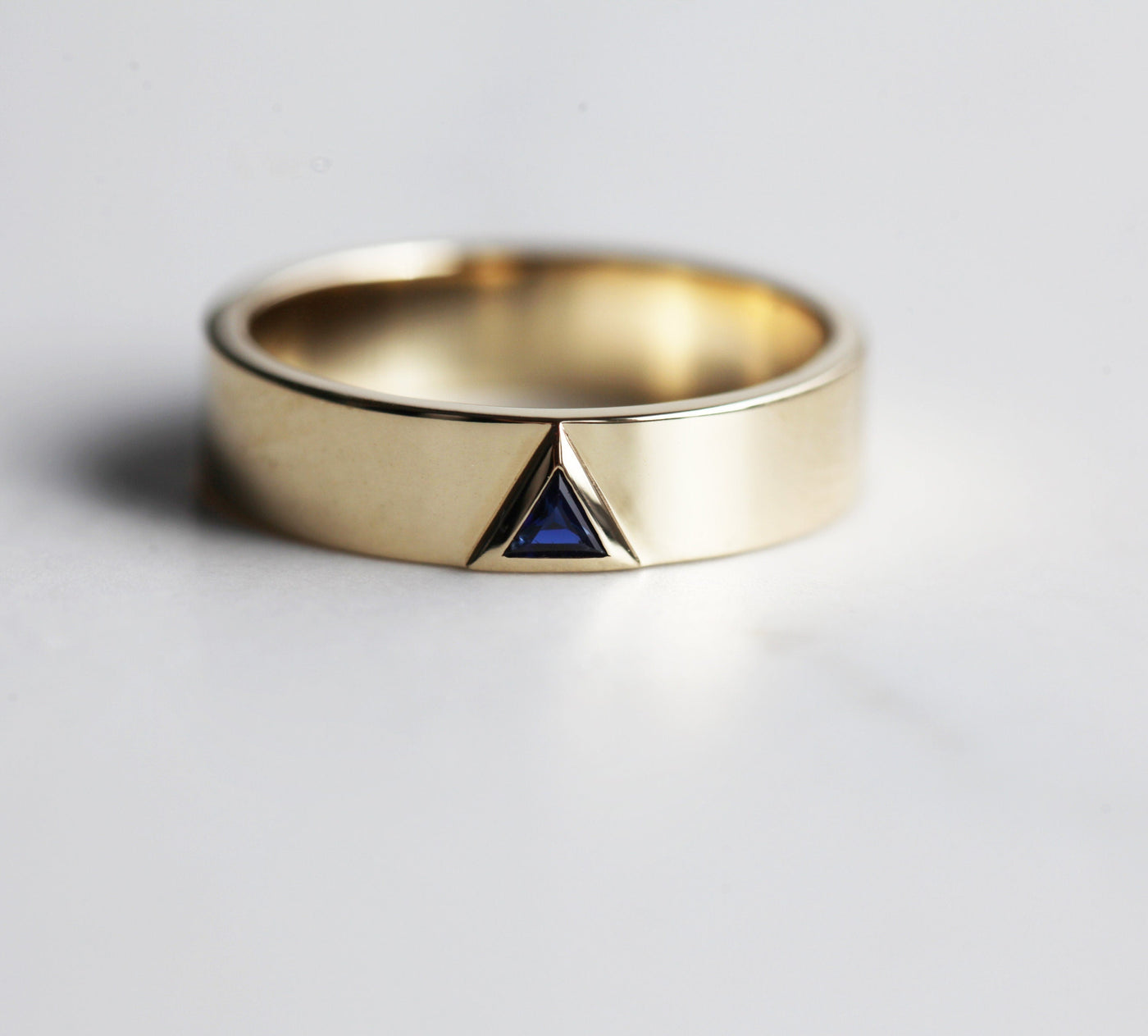 Blue triangle sapphire wedding band