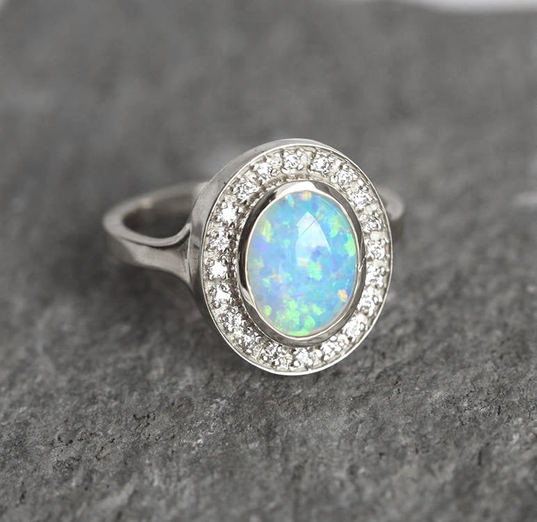 Oval Opal Halo White Gold Ring with Side White Round Diamonds