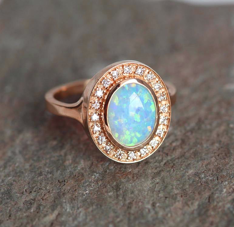 Oval Opal Halo Rose Gold Ring with Side White Round Diamonds