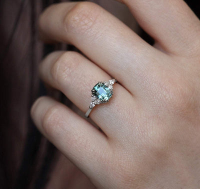 Blue cushion-cut ceylon sapphire ring with side diamonds