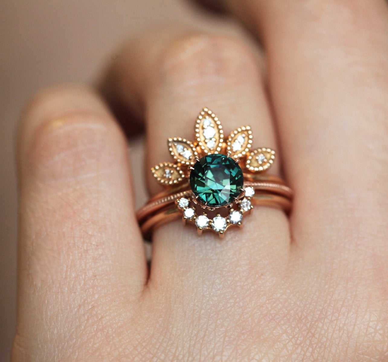 Round blue green solitaire sapphire ring