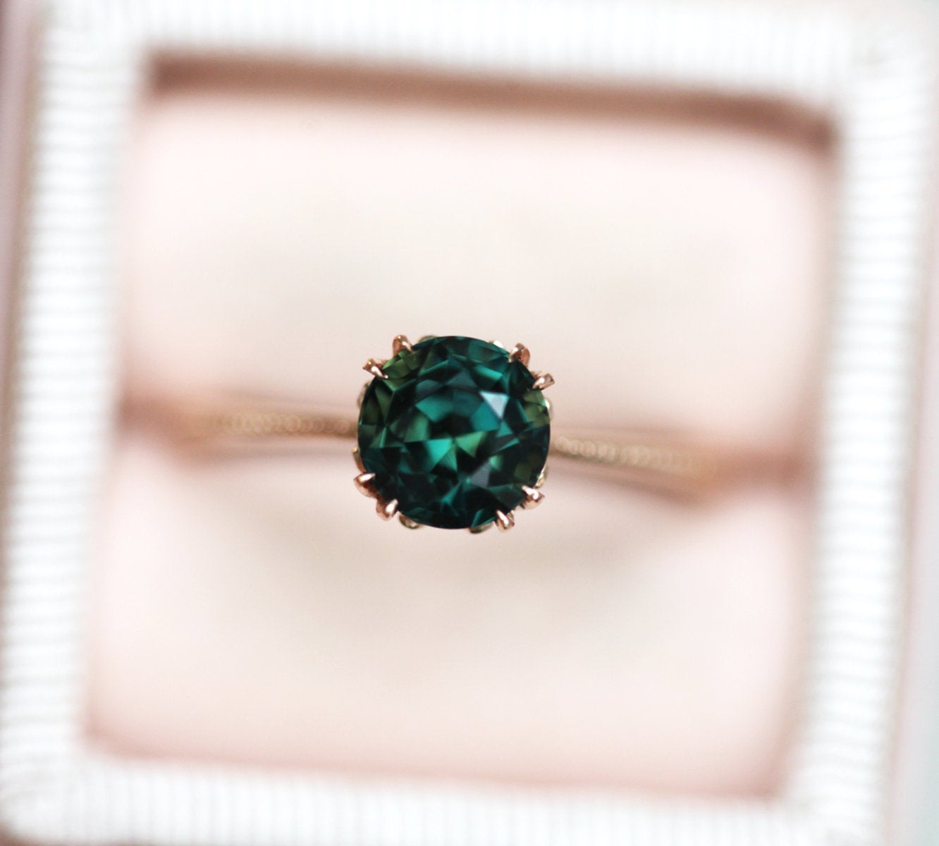 Round blue green solitaire sapphire ring